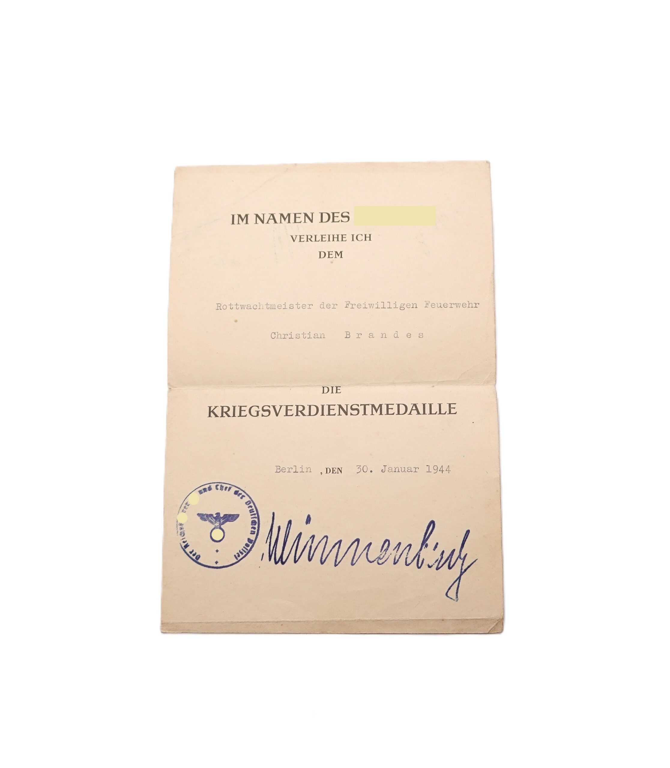 Verleihungsurkunde zur Kriegsverdienstmedaille 1939 - Für einen Rottwachmeister der Feuerwehr - FU Wünneberg - Urkunde